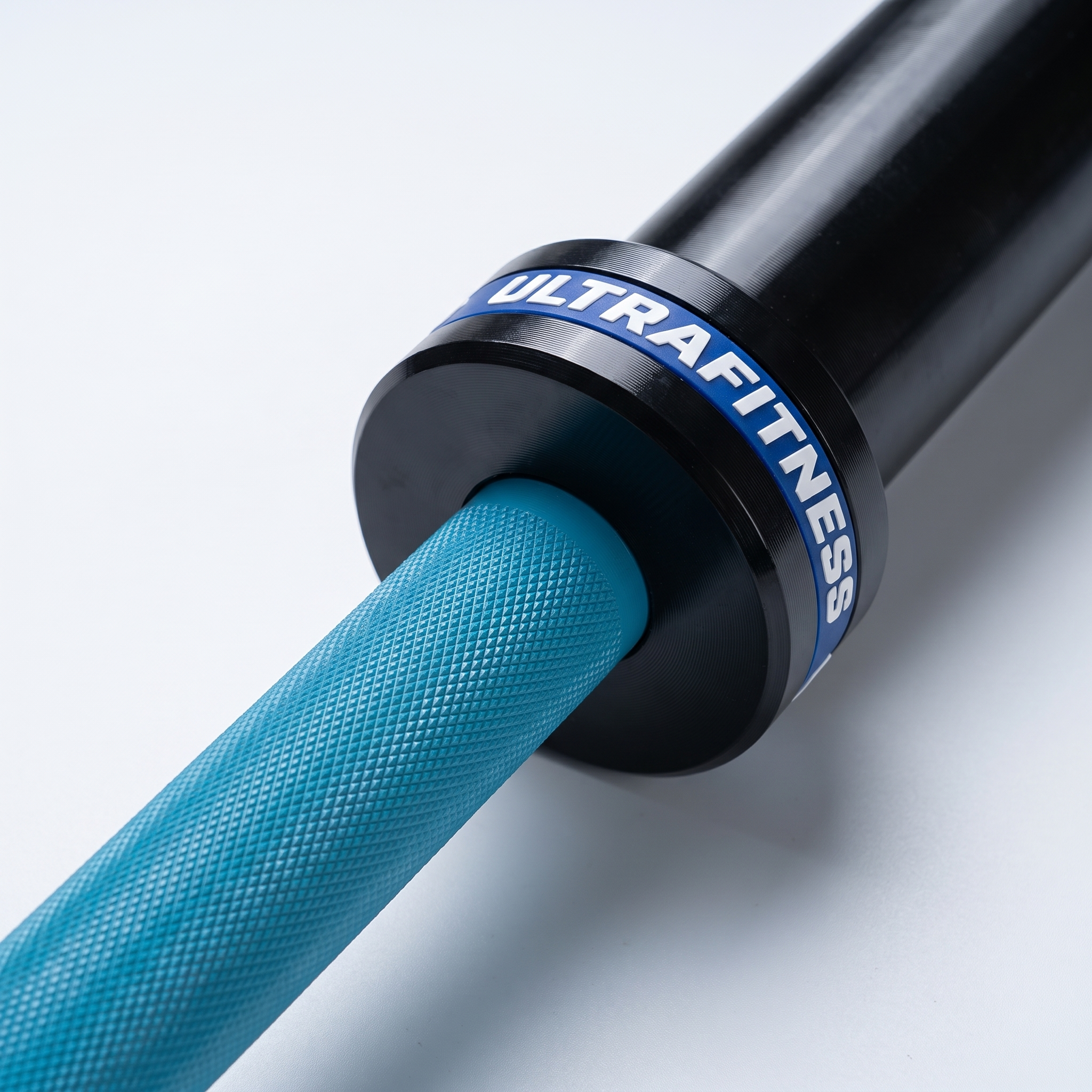 Barre olympique UltraFitness - close-up manchon et fût grainé